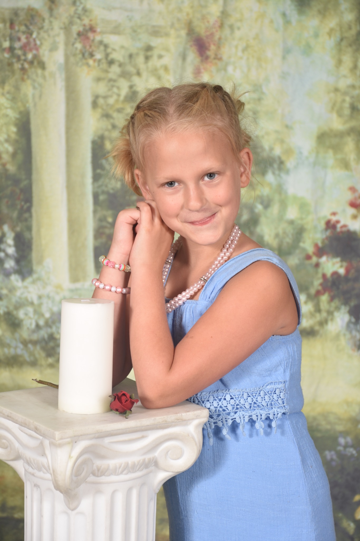 Children's studio portrait in a blue dress by David Allen Sussman